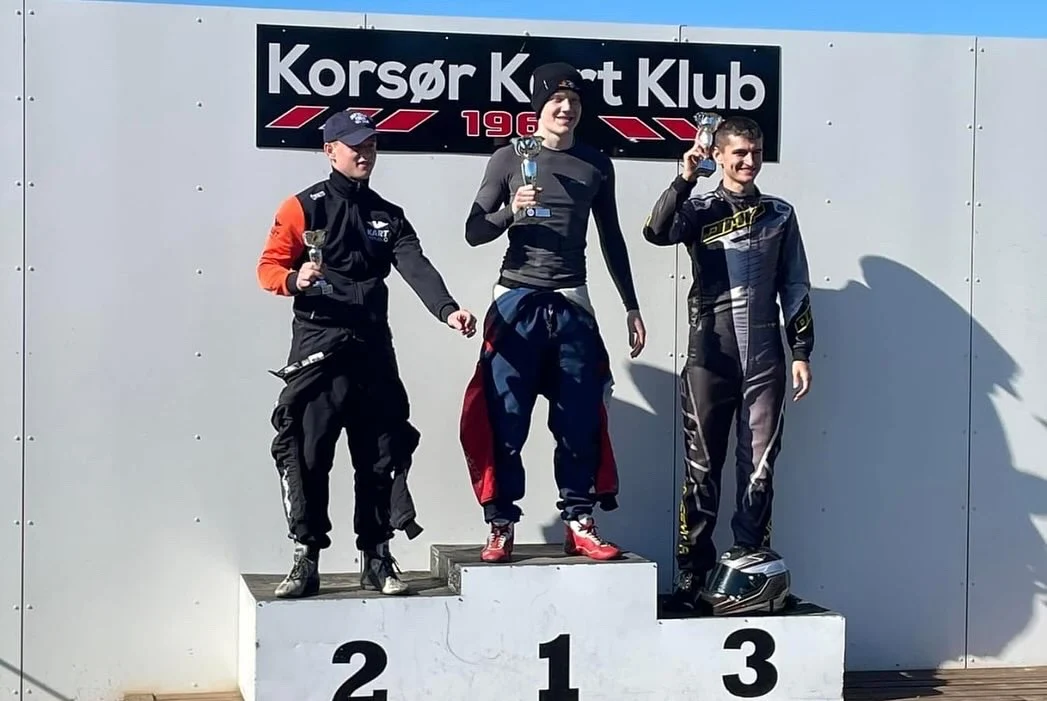 Karting drivers with trophies on the podium at Korsør Kart Klub
