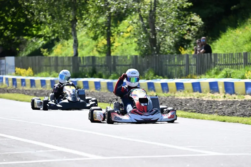 Karting on track with a wave from the driver