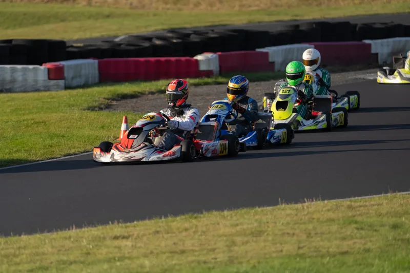 EKS kart in close racing through a corner · Photo: Helle Dahl
