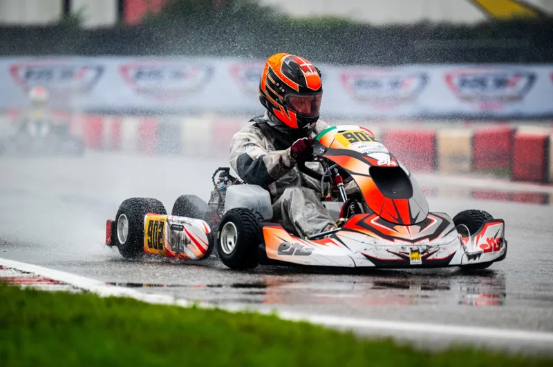 EKS kart with spray from the track